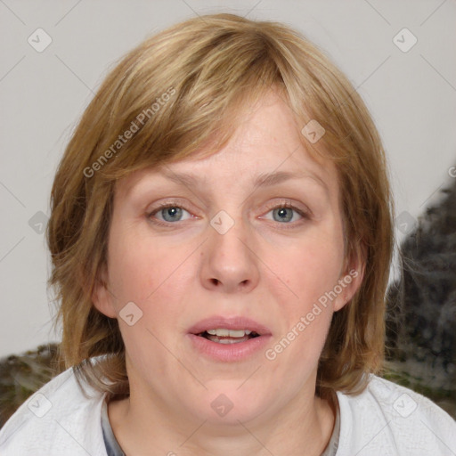 Joyful white adult female with medium  brown hair and blue eyes