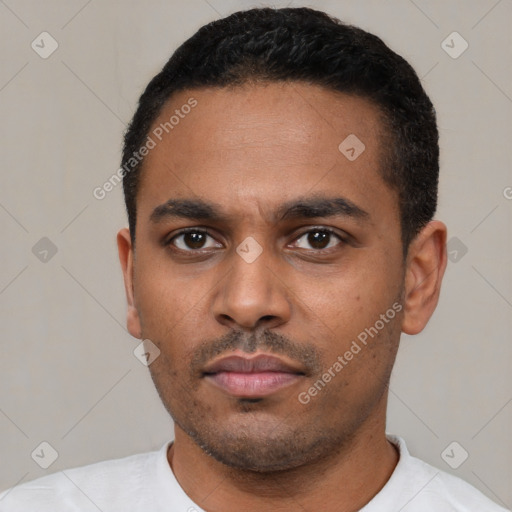 Neutral latino young-adult male with short  black hair and brown eyes