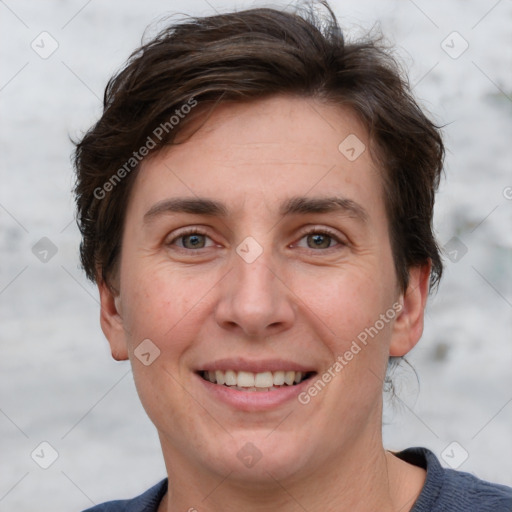 Joyful white adult female with short  brown hair and grey eyes