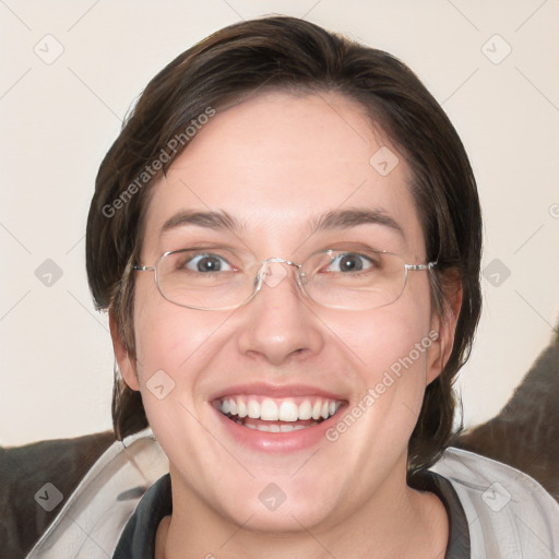 Joyful white adult female with medium  brown hair and blue eyes