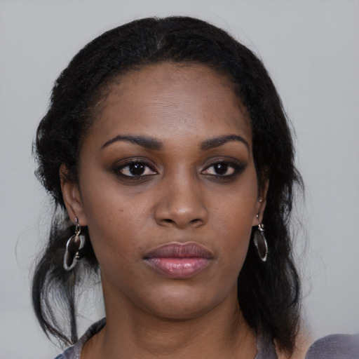Neutral black young-adult female with medium  black hair and brown eyes