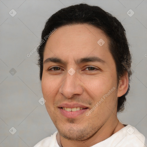 Joyful white adult male with short  brown hair and brown eyes