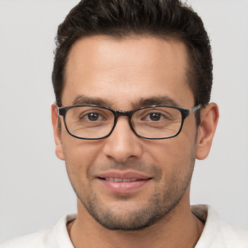 Joyful white young-adult male with short  brown hair and brown eyes