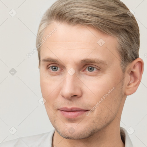 Joyful white adult male with short  brown hair and brown eyes