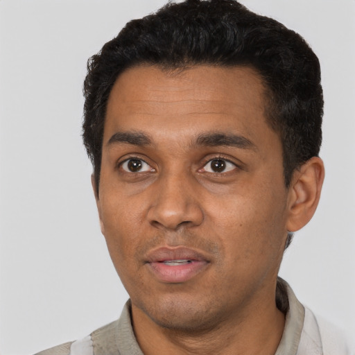 Neutral black young-adult male with short  black hair and brown eyes