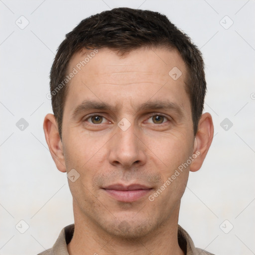 Joyful white young-adult male with short  brown hair and brown eyes