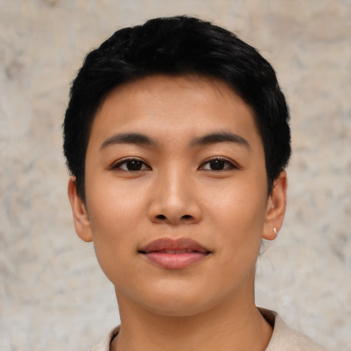 Joyful asian young-adult female with short  black hair and brown eyes