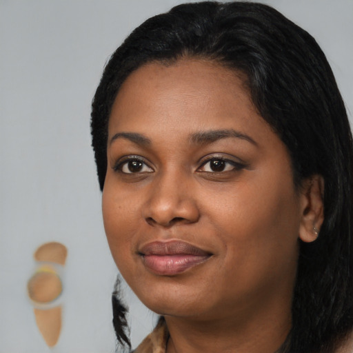 Joyful black young-adult female with medium  black hair and brown eyes