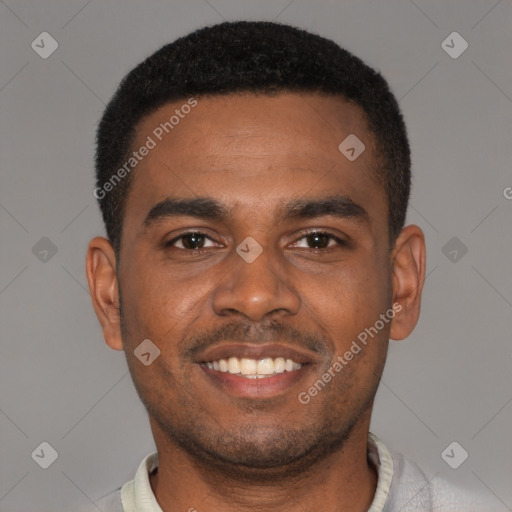 Joyful black young-adult male with short  black hair and brown eyes