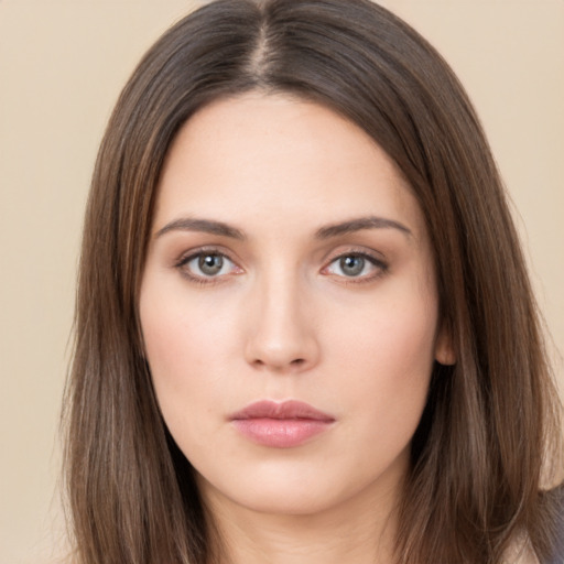 Neutral white young-adult female with long  brown hair and brown eyes