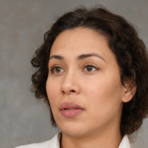 Neutral white young-adult female with medium  brown hair and brown eyes