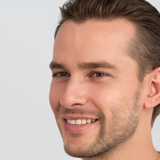 Joyful white young-adult male with short  brown hair and brown eyes