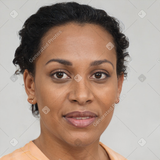 Joyful black adult female with short  brown hair and brown eyes