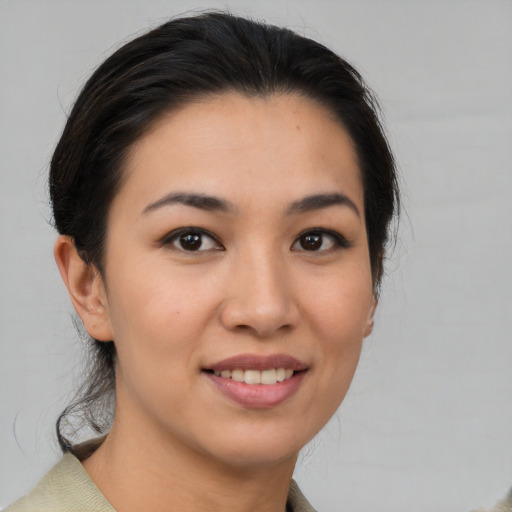 Joyful white young-adult female with medium  brown hair and brown eyes