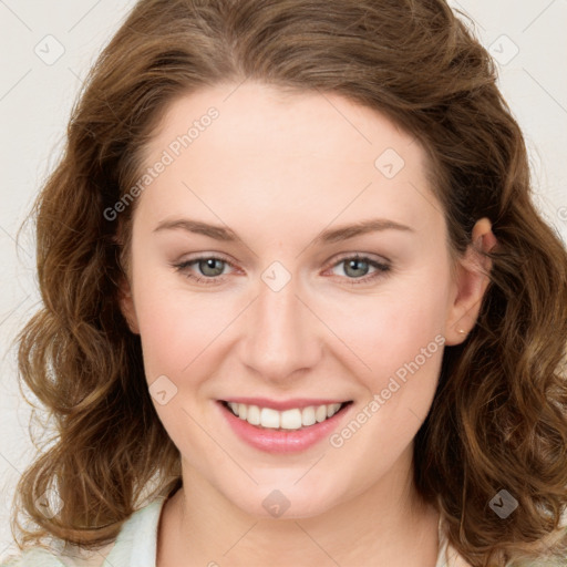 Joyful white young-adult female with long  brown hair and green eyes