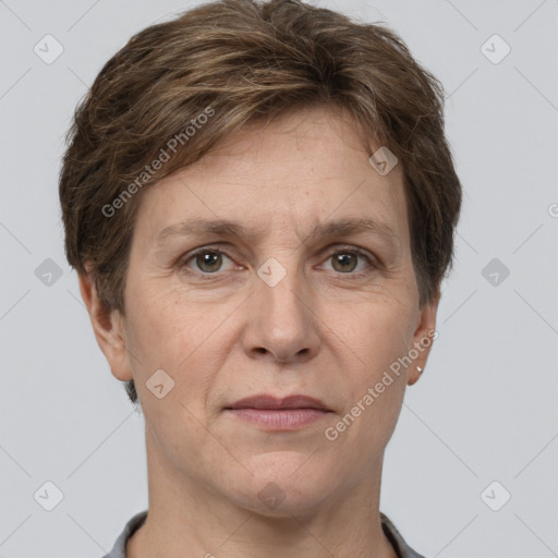 Joyful white adult female with short  brown hair and grey eyes