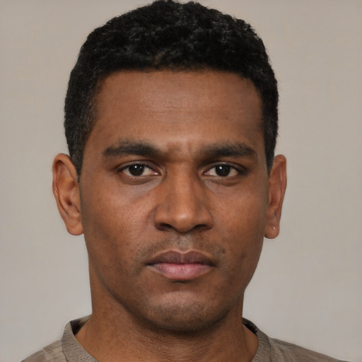 Neutral black young-adult male with short  black hair and brown eyes