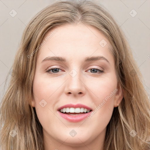 Joyful white young-adult female with long  brown hair and grey eyes