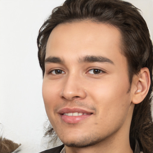 Joyful white young-adult male with medium  brown hair and brown eyes