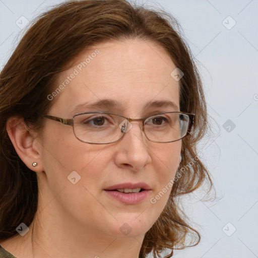 Joyful white adult female with medium  brown hair and blue eyes