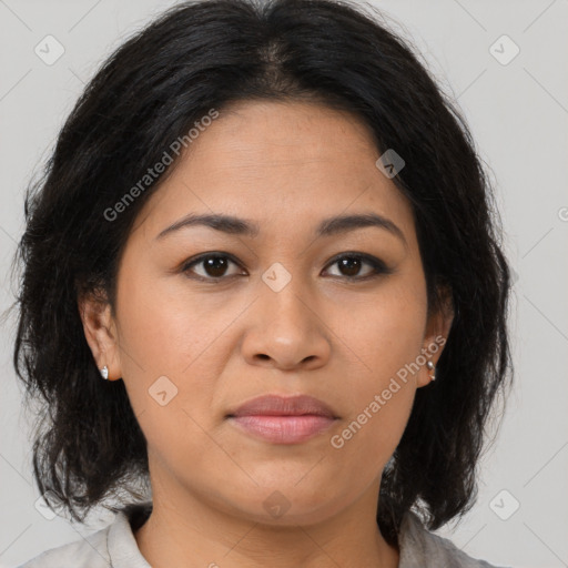 Joyful latino young-adult female with medium  brown hair and brown eyes