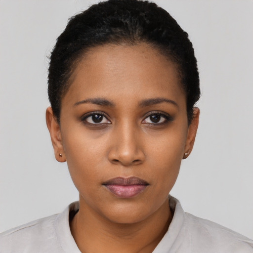 Neutral black young-adult female with short  black hair and brown eyes