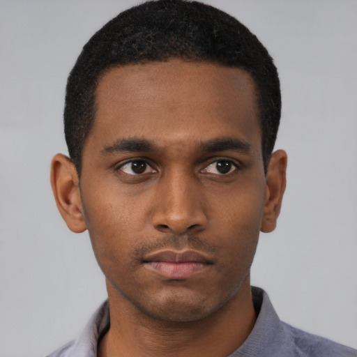 Neutral black young-adult male with short  black hair and brown eyes
