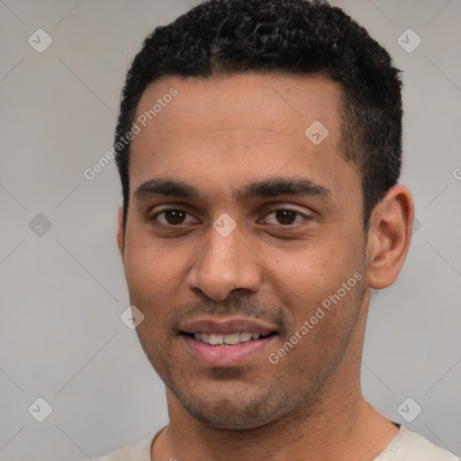 Joyful white young-adult male with short  black hair and brown eyes