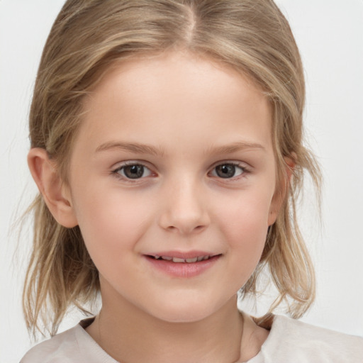 Joyful white child female with medium  brown hair and brown eyes