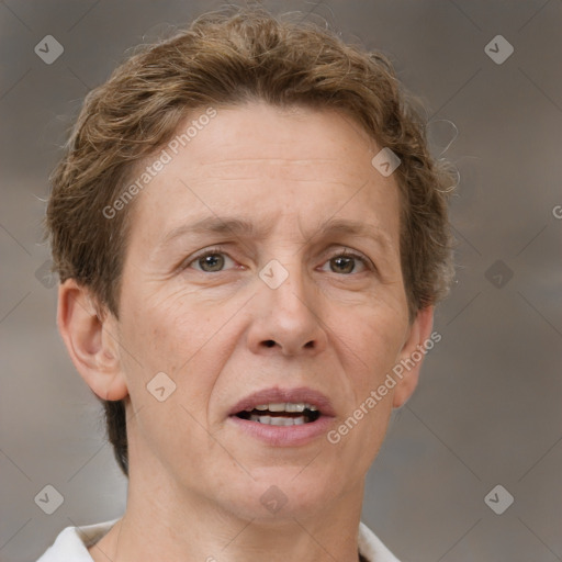 Joyful white adult female with short  brown hair and brown eyes