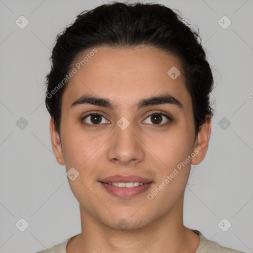 Joyful white young-adult male with short  black hair and brown eyes