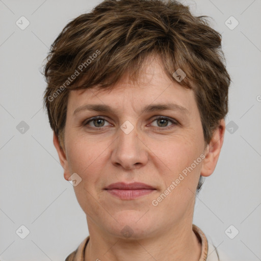 Joyful white adult female with short  brown hair and grey eyes