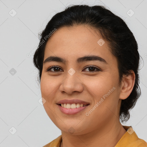 Joyful latino young-adult female with medium  brown hair and brown eyes