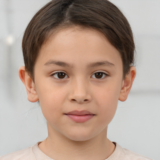 Joyful white child female with short  brown hair and brown eyes