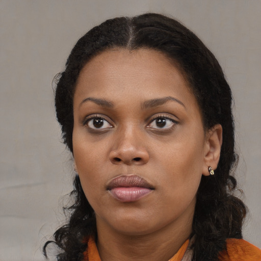 Neutral black young-adult female with medium  black hair and brown eyes