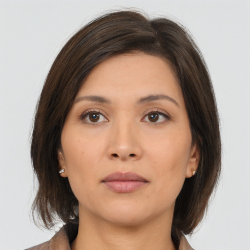 Neutral asian young-adult female with medium  brown hair and brown eyes