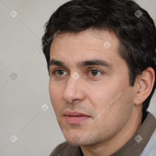 Neutral white adult male with short  black hair and brown eyes