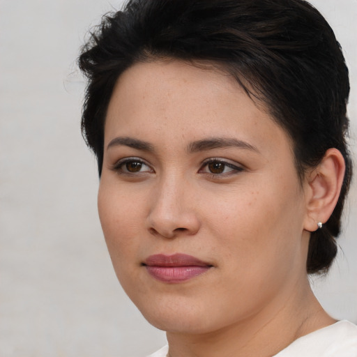 Joyful asian young-adult female with medium  brown hair and brown eyes
