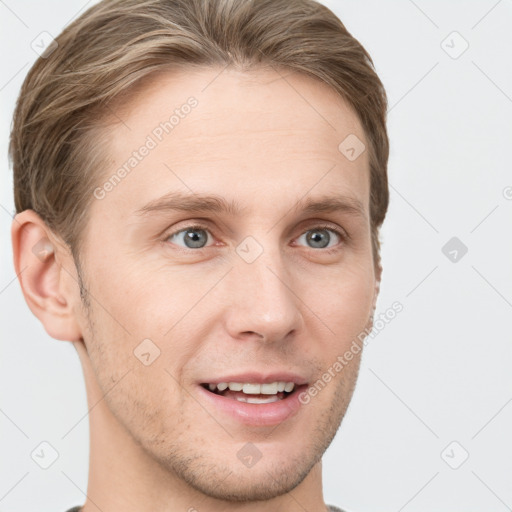 Joyful white young-adult male with short  brown hair and grey eyes