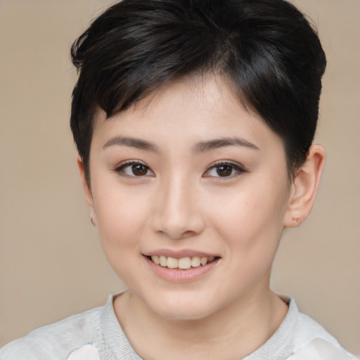 Joyful asian young-adult female with short  brown hair and brown eyes