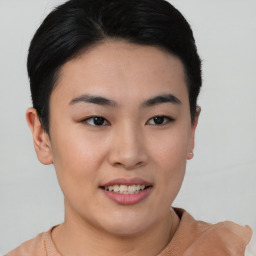 Joyful asian young-adult female with short  brown hair and brown eyes