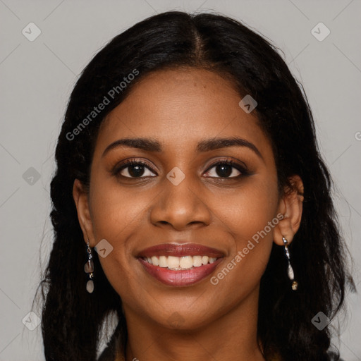 Joyful black young-adult female with long  black hair and brown eyes