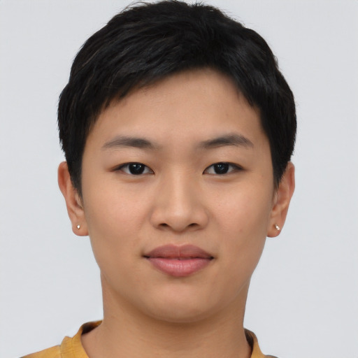 Joyful asian young-adult female with short  black hair and brown eyes
