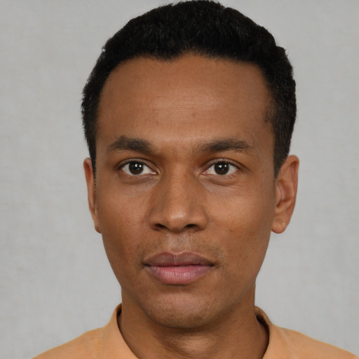 Neutral black young-adult male with short  black hair and brown eyes