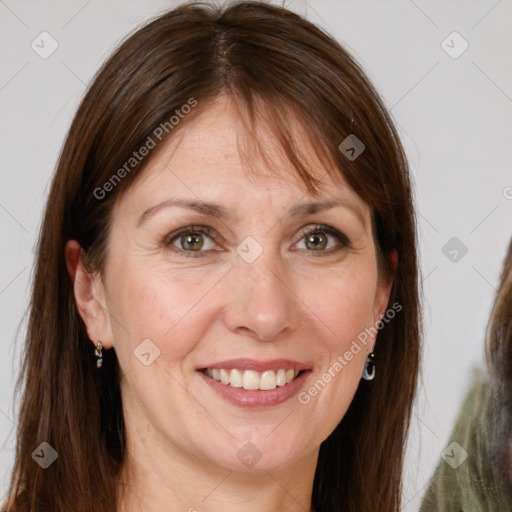 Joyful white adult female with long  brown hair and brown eyes