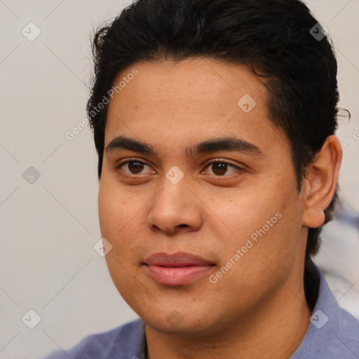 Joyful latino young-adult male with short  black hair and brown eyes