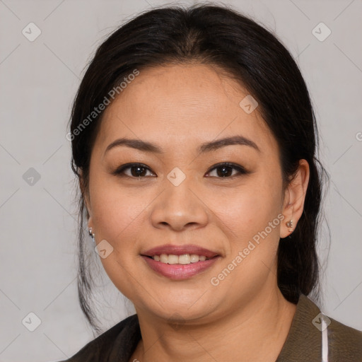 Joyful latino young-adult female with medium  brown hair and brown eyes