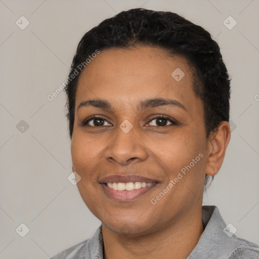 Joyful latino young-adult female with short  black hair and brown eyes