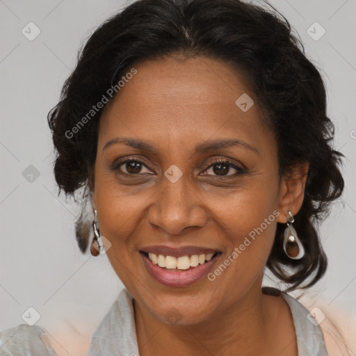 Joyful black adult female with medium  brown hair and brown eyes