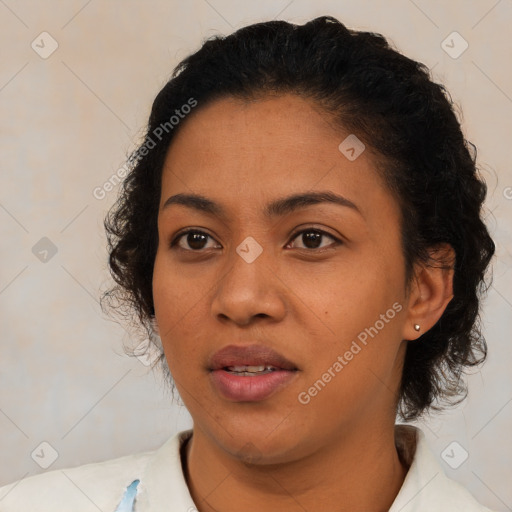 Joyful latino young-adult female with short  brown hair and brown eyes